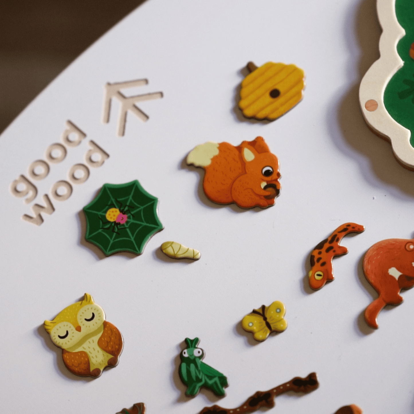 goodwood table top rocker in white colour with forest puzzles