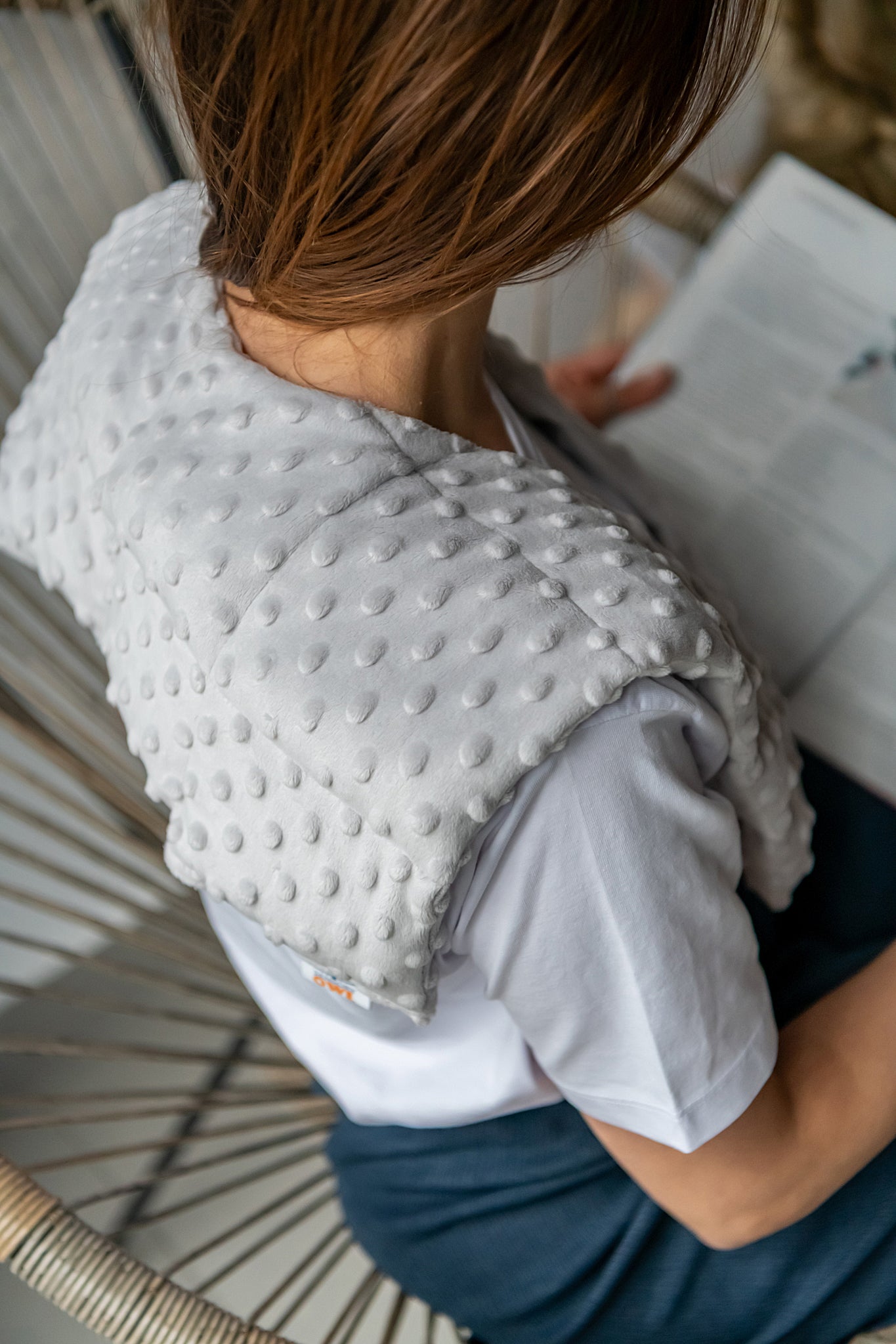 woman wearing long minky weighted collar  in light grey shade made by sensory owl 