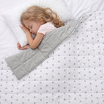 girl sleeping under the grey stars weighted blanket