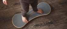 Load image into Gallery viewer, A CHILD BALANCING ON THE BALANCE BOARD / TRICK BOARD FOR KIDS- GOOD WOOD