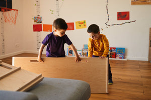 two boys playing with good wood ladder/ slider in natural colour