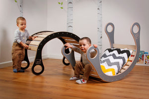 children playing with good wood rocker 