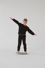 Load image into Gallery viewer, A BOY BALANCING ON THE BALANCE BOARD / TRICK BOARD FOR KIDS- GOOD WOOD