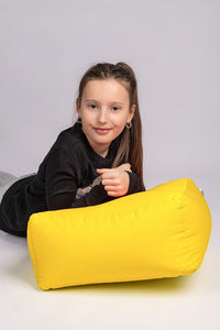 GIRL LEANING UPON YELLOW COTTON SQUARE POUF