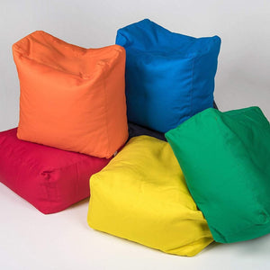 COTTON SQUARE POUFS ON THE FLOOR IN GREEN, YELLOW, BLUE, RED AND ORANGE| SENSORY OWL