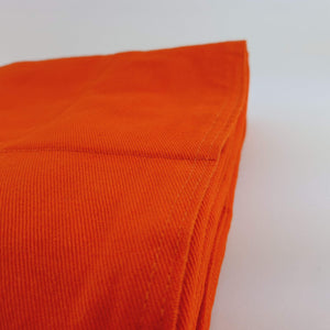 orange cotton weighted blanket close up photo